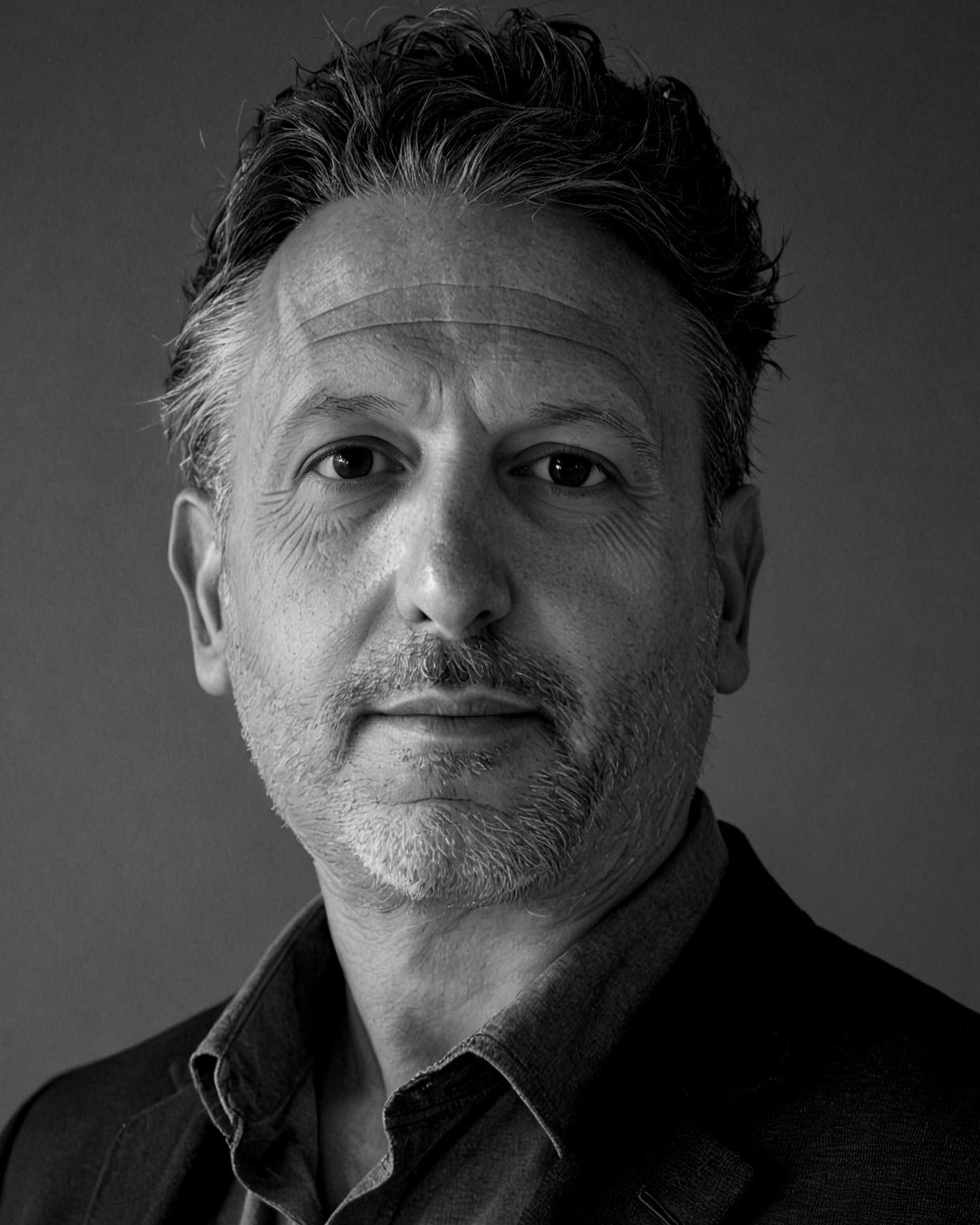 Andrew Mark Klapper, photographed in close portrait.